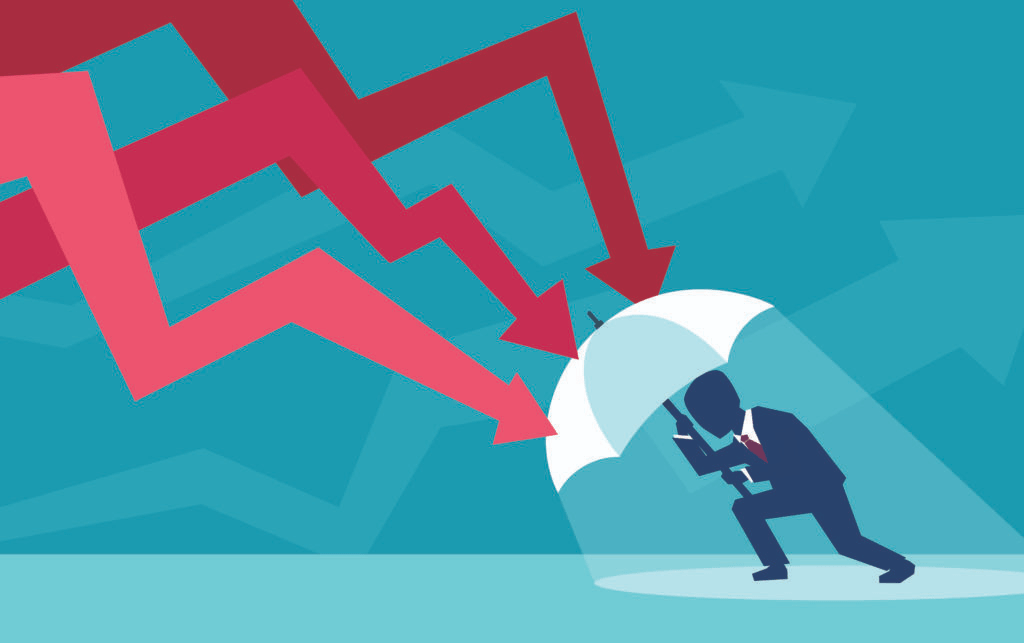 Cartoon of a man crouching down under an umbrella with red arrows pressing down on it that look like falling stocks on a graph