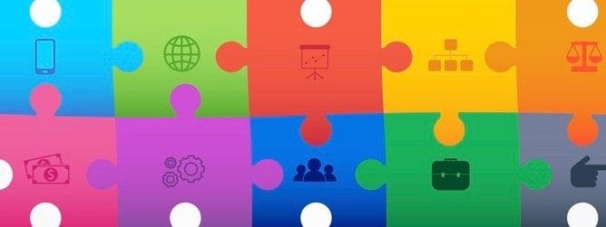 Multi-coloured jigsaw puzzle in an oblong made up of pieces with symbols like a phone and the WiFi symbol