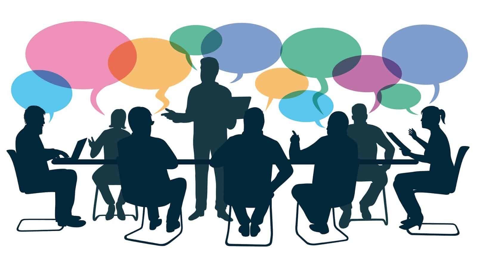 Silhouettes of people at a meeting with multi-coloured speech bubbles